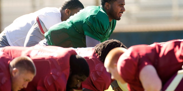 Florida State quarterback EJ Manuel runs drills during practice, Thursday, Dec. 27, 2012, in Davie, Fla. Florida State is scheduled to play Northern Illinois in the Orange Bowl NCAA college football game on Tuesday, Jan. 1, 2013. (AP Photo/J Pat Carter)