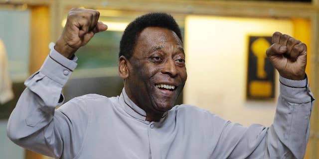 FILE - In this June 15, 2014 file photo, soccer great Pele poses for photos during the inauguration of the Pele Museum, in Santos, Brazil. Soccer great Pele isn't showing signs of the urinary tract infection that prompted his hospitalization and doctors said they will suspend kidney treatment. The Albert Einstein hospital in Sao Paulo said Saturday, Nov. 29, 2014, that the 74-year-old Pele remains in an intensive care unit, but his condition was constantly improving. (AP Photo/Nelson Antoine, File)