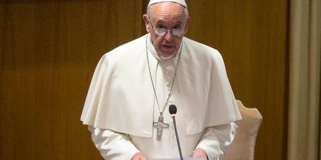 Pope Francis delivers a speech before the start of the morning session of the Synod of bishops, at the Vatican, Friday, Oct. 9, 2015. (AP Photo/Alessandra Tarantino)