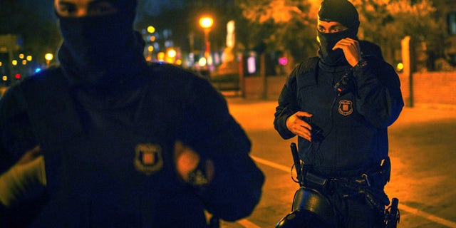 BARCELONA, SPAIN - MARCH 11: Catalan Autonomous riot police officers stand guard at the first Pegida rally on March 11, 2015 in Barcelona, Spain. Pegida Catalonia has called for the first Pegida Spain march in on the 11th anniversary of the 2004 Madrid train bombings. (Photo by David Ramos/Getty Images)