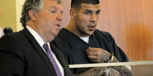 June 27, 2013: Former New England Patriots tight end Aaron Hernandez makes a court appearance in connection to the death of Odin Lloyd, a 27-year-old Boston semi-professional football player whose body was found June 17 about a mile from Hernandez's home in North Attleborough, Mass. (AP)