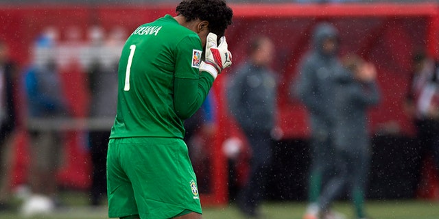 Brazilian goalkeeper Luciana reacts after losing 1-0 to Australia in FIFA Women's World Cup soccer in Moncton, New Brunswick, Canada, Sunday, June 21, 2015. Australia advances to the quarter-finals. (Andrew Vaughan/The Canadian Press via AP) MANDATORY CREDIT