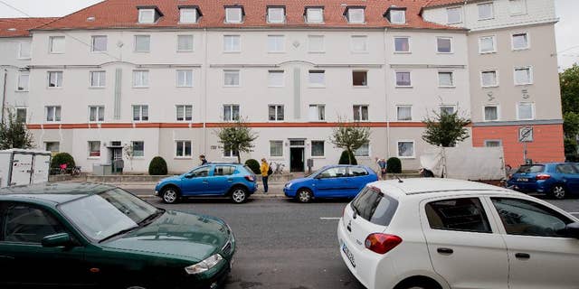 A residential house in the borough of Vahrenwald in Hannover, Germany, Friday, Sept. 30, 2016. The skeleton of a dead newborn and a living baby have been found in a suitcase inside a flat of the residential house. (Julian Stratenschulte/dpa via AP)