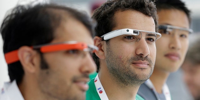 May 15, 2013: Google Glass team members wear Google Glasses at a booth at Google I/O 2013 in San Francisco.