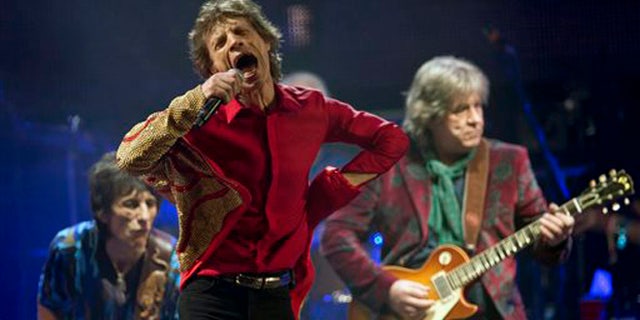 FILE - In this June 29, 2013 file photo Mick Jagger, center, Ronnie Wood, left, and Mick Taylor, of British rock band The Rolling Stones, perform on the Pyramid main stage at Glastonbury, England. The Rolling Stones on Tuesday, Nov. 19, 2013 announced theyâll be playing a gig March 22, 2014 at the Adelaide Oval in Australia. The band hasnât played the country since 2006. A news release says former member Taylor will be a special guest for the concert. (Photo by Joel Ryan/Invision/AP, File)