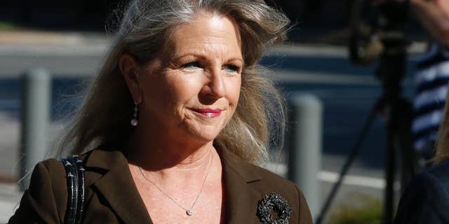 FILE - In this Sept. 4, 2014, file photo, Former Virginia first lady Maureen McDonnell arrives at federal court for the third day of jury deliberations in her corruption trial in Richmond, Va. For more than a month, McDonnell quietly listened as witnesses portrayed her as a hostile and rapacious governor’s wife whose greed led to her husband’s downfall as well as her own. Enduring such highly public humiliation is punishment enough without adding prison time, her lawyers have argued in court papers prior to a hearing Friday, Feb. 20, 2015, in which McDonnell is to be sentenced. (AP Photo/Steve Helber, File)