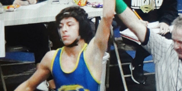 This February 2016 photo provided by team wrestling coach Ray Castellanos, shows high school wrestler Jeremy Sanchez competing at the 113 lb. finals in the California Interscholastic Federation championship in Santa Ana, Calif.