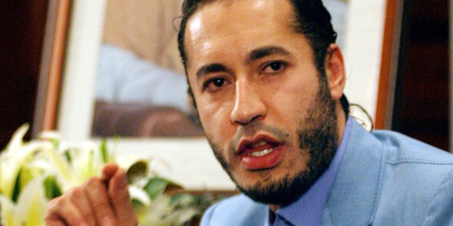 FILE 2005: Al-Saadi Qaddafi, the son of Muammar Qaddafi, answers a question during a press conference in Sydney.