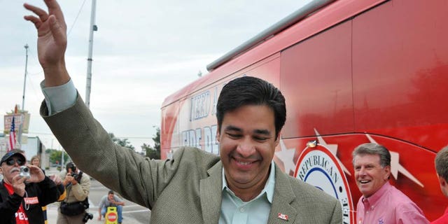 Raul Labrador, Republican challenger for Idaho's first congressional district, waves to an enthusiastic crowd flanked by Idaho governor C.L. "Butch" Otter, right, after arriving at a rally on Saturday October 9, 2010 in Caldwell, Idaho. Labrador, an attorney and two-term state lawmaker, is bidding to unseat Democrat Walt Minnick. (AP Photo/Idaho Press-Tribune, Mike Vogt)