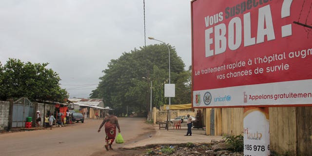 A billboard with a message about Ebola is seen on a street in Conakry, Guinea October 26, 2014.
