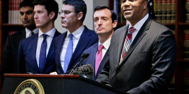 U.S. Attorney Robert Capers, right, speaks during a news conference, announcing charges for Mexican drug kingpin Joaquin "El Chapo" Guzman as the murderous architect of a three-decade-long web of violence, corruption and drug trafficking in Jan., 2017. (AP Photo/Mark Lennihan)