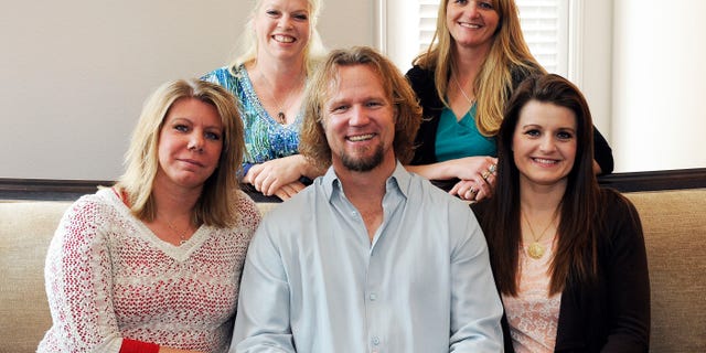 Kody Brown poses with his wives.