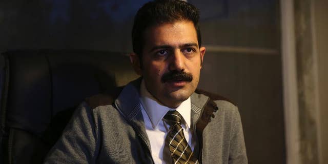 Amir Raisian the lawyer of imprisoned Iranian human rights activist Arash Sadeghi speaks in an interview with The Associated Press at his office in Tehran, Iran, Tuesday, Jan, 3, 2017. Arash Sadeghi ended a 71-day hunger strike Tuesday as his detained wife won a temporary release from prison, a day after his case sparked a rare unauthorized protest in Tehran. Sadeghi's hunger strike began Oct. 24 after authorities arrested his wife to make her serve a six-year sentence over an unpublished fictional story found in her home about a woman burning a Quran in anger over another woman being stoned to death for adultery. (AP Photo/Vahid Salemi)
