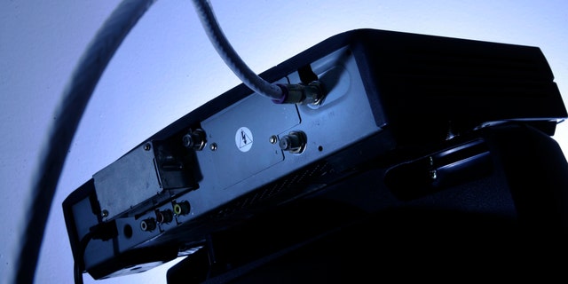 This file photo shows a cable box on top of a television. AP Photo