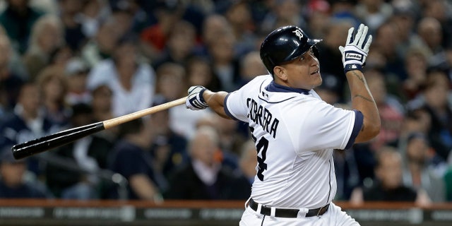 In this Sept. 16, 2013, photo, Detroit Tigers' Miguel Cabrera bats against the Seattle Mariners in a baseball game in Detroit. Cabrera has won the American League Most Valuable Player award for the second straight year. Cabrera won by a comfortable margin Thursday, Nov. 14, getting 23 of 30 first-place votes from members of the Baseball Writers' Association of America. (AP Photo/Paul Sancya)