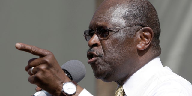 Republican presidential candidate Herman Cain speaks to supporters while campaigning at Versailles Restaurant, Wednesday, Nov. 16, 2011, in the Little Havana neighborhood of Miami. (AP Photo/ Lynne Sladky)