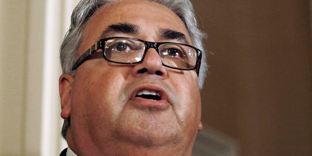 June 10, 2013, In this file photo, State Sen. Ron Calderon, D-Montebello, left, holds a news conference at the Capitol in Sacramento, Calif.