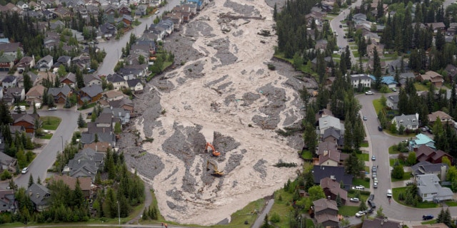 June 21, 2013: The flooded Cougar Creek runs through Canmore, Alberta.