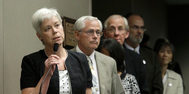 Amanda Wilcox, left, accompanied by her husband Nick Wilcox, second from left, whose daughter, Laura, was killed in a 2001 Nevada County shooting spree, joined others in calling on lawmakers to approve a bill aimed at abolishing capital punishment, at a hearing of the Assembly Public Safety Committee at the Capitol in Sacramento, Calif., Thursday, July 7, 2011.