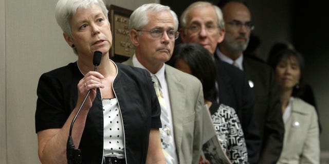 Amanda Wilcox, left, accompanied by her husband Nick Wilcox, second from left, whose daughter, Laura, was killed in a 2001 Nevada County shooting spree, joined others in calling on lawmakers to approve a bill aimed at abolishing capital punishment, at a hearing of the Assembly Public Safety Committee at the Capitol in Sacramento, Calif., Thursday, July 7, 2011.
