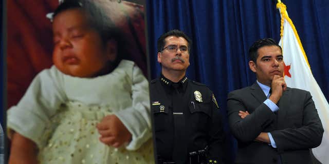 March 25, 2015: Long Beach Police Chief Robert Luna, left, and Mayor Robert Garcia stand during a news conference in Long Beach, Calif.