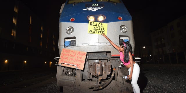 Dec. 8, 2014: Protesters block an Amtrak passenger train in Berkeley, Calif.