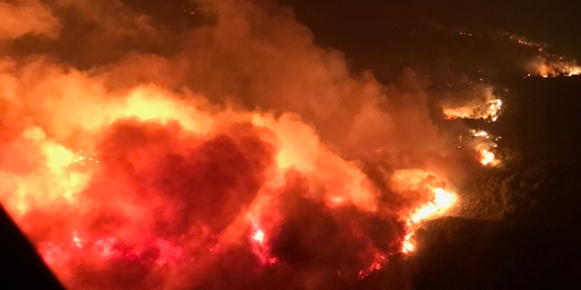 A wildfire is shown from the air near Atlas Road during an operation to rescue people trapped by wildfire in Napa, Califonria.