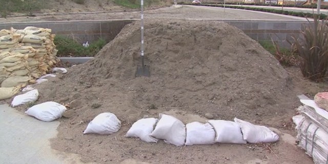 Officials handed out sandbags to residents near areas affected by the recent wildfires in Southern California.