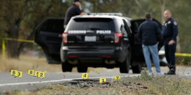 Yellow tags mark where bullet casings found at one of the scenes of a shooting spree at Rancho Tehama Reserve, near Corning, Calif., Tuesday, Nov. 14, 2017