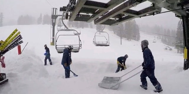 In this image provided by the Kirkwood Mountain Resort, fresh snow is cleared below a ski lift Friday, March 2, 2018, in Kirkwood, Calif.