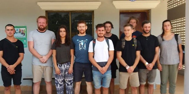 The group of ten tourists detained are being being charged with "producing pornography" after Cambodian police discovered suggestive photos of the group during a raid. They could face up to a year in a Cambodian prison.
