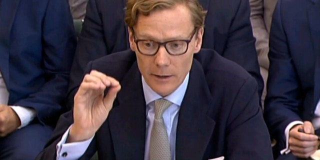 Former Chief Executive of Cambridge Analytica Alexander Nix, gives evidence to the Digital, Culture, Media and Sport Committee inquiry into fake news at Portcullis House in London, Wednesday, June 6, 2018. The former head of the defunct political consultant Cambridge Analytica clashed Wednesday with British lawmakers investigating the use of Facebook data in election campaigns, claiming that the firm had become the subject of global derision because of its involvement in Donald Trumpââ¬â¢s 2016 presidential campaign. (PA via AP)