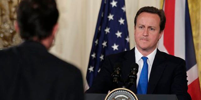 British Prime Minister David Cameron is seen at a news conference with President Obama, not shown, in the East Room of the White House July 20. (AP Photo)