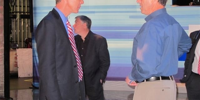 Fox News Chief Political Correspondent Carl Cameron talks with former Sen. Rick Santorum, R-Pa., on the stage of Thursday’s GOP debate in Greenville, S.C. (Fox News Photo / Katy Ricalde)