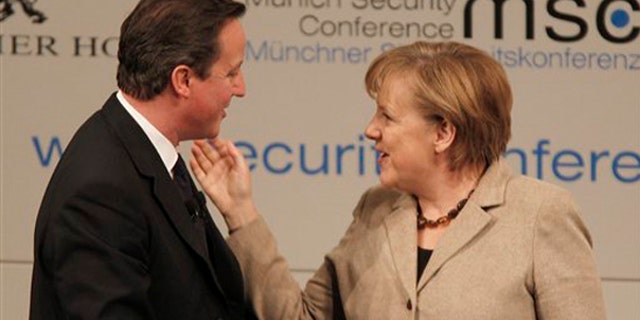 Saturday: British Prime Minister David Cameron chats with German Chancellor Angela Merkel after attending a panel discussion during the Conference on Security Policy in Munich, Germany.