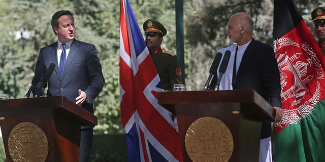 Oct. 3, 2014: Afghanistan's president Ashraf Ghani Ahmadzai, second right, listens as Britain's Prime Minister David Cameron talks during a news conference at the presidential palace in Kabul, Afghanistan. (AP)