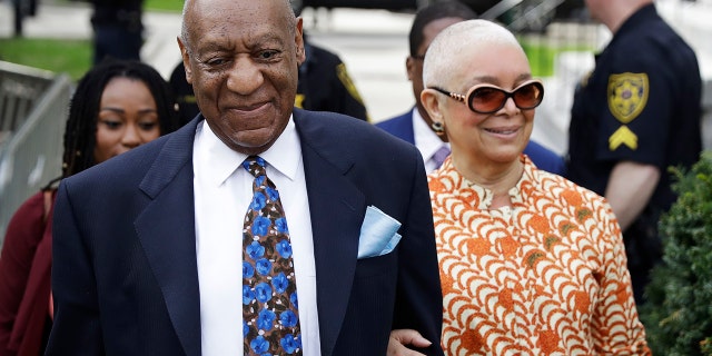 Bill Cosby, left, arrives with his wife, Camille, for his sexual assault trial, Tuesday, April 24, 2018, at the Montgomery County Courthouse in Norristown, Pa.