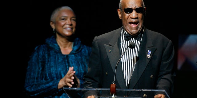 Comedian Bill Cosby addresses the crowd in front of his wife, Camille Cosby, after being honored during the Apollo Theatre's 75th anniversary gala in New York, June 8, 2009. REUTERS