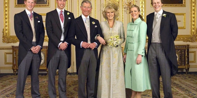 Prince Charles and Camilla Parker Bowles are pictured on their wedding day with all of their children (L-R) Prince Harry, Prince William and Laura and Tom Parker Bowles, in the White Drawing Room at Windsor Castle, April 10, 2005.