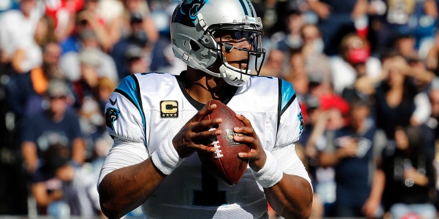 Carolina Panthers quarterback Cam Newton looks for a receiver during an NFL game in Foxborough, Mass., Oct. 1, 2017.