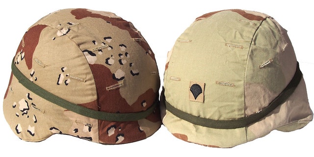 Two very different camouflage pattern helmet covers that were used by the U.S. Military in Iraq.