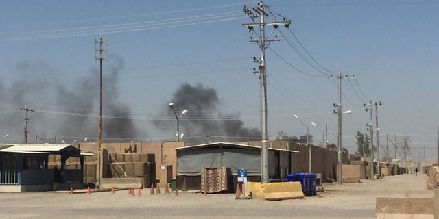 The U.S. Army soldier that provided the photos says that the pits are about 400 yards from thier barracks and that the smoke often hangs over their section of the base.