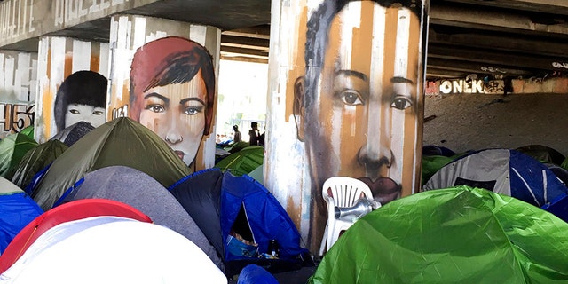 The French government is looking to evacuate two migrant camps near Paris