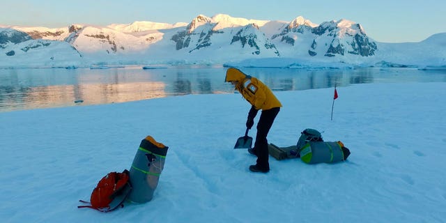 Campers must dig a coffin-sized hole in the snow to help block themselves from wind while sleeping.