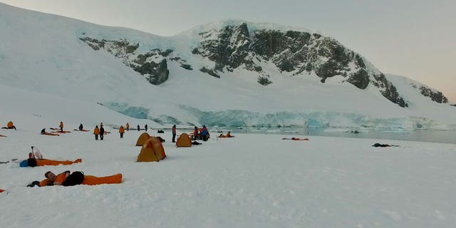 The snow-covered campsite, right next to the water, was quite a sight. There were snowy peaks as far as the eye could see.