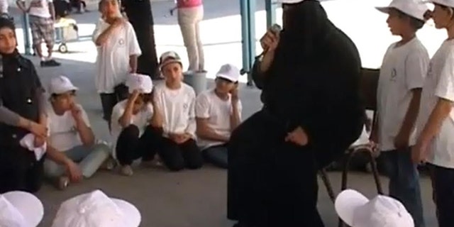 A camp instructor at a UN-affiliated youth camp in Gaza tells kids it is their duty to take back Israel.