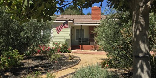 Sept. 7, 2015: A home is shown, Monday, Sept. 7, 2015, in the Los Angeles suburb of La Canada-Flintridge, Calif., where on Sunday night, firefighter James M. Taylor fatally shot his wife, Cecilia Hoschet, herself a deputy with the Los Angeles County Sheriff's Department, before later killing himself at a county fire station.
