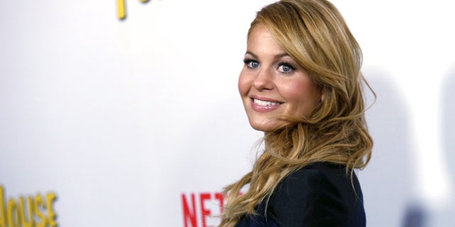 Cast member Candace Cameron Bure poses at the premiere for the Netflix television series "Fuller House" at The Grove in Los Angeles.