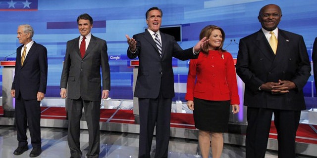 From left to right, Rep. Ron Paul; Texas Gov. Rick Perry; former Massachusetts Gov. Mitt Romney; Rep. Michele Bachmann; and businessman Herman Cain pose before a Fox News/Google debate in Orlando, Fla., Sept. 22.