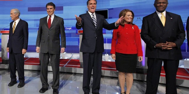 From left to right, Rep. Ron Paul; Texas Gov. Rick Perry; former Massachusetts Gov. Mitt Romney; Rep. Michele Bachmann; and businessman Herman Cain pose before a Fox News/Google debate in Orlando, Fla., Sept. 22.